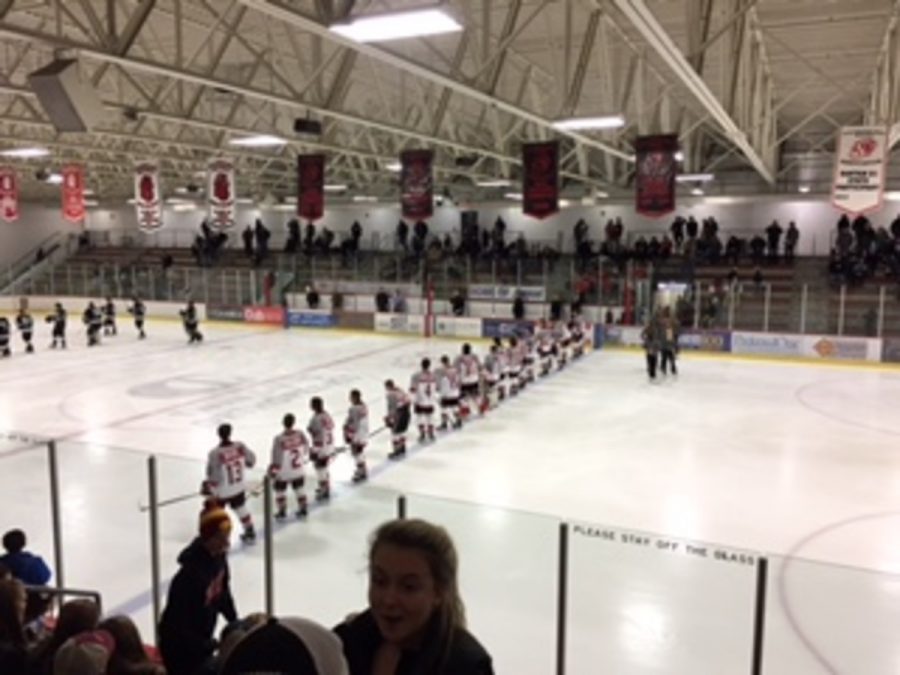 The boys varsity hockey team lines up on the blue line at the St. Croix Rec Center for the singing of the national anthem before they take on Roseville in front of a home crowd. Junior forward Josh long said, Playing at the Rec Center and in front of a big crowd gets us hyped for a big game.