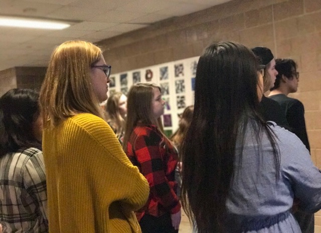 Students gathering outside the classroom to critique their artwork along with others that hang on the walls of SAHS. “The type of art my students do varies. Some examples are clay, drawing, painting, mixed media, sewing, sculpture and more,” teacher Carey Nisi says.