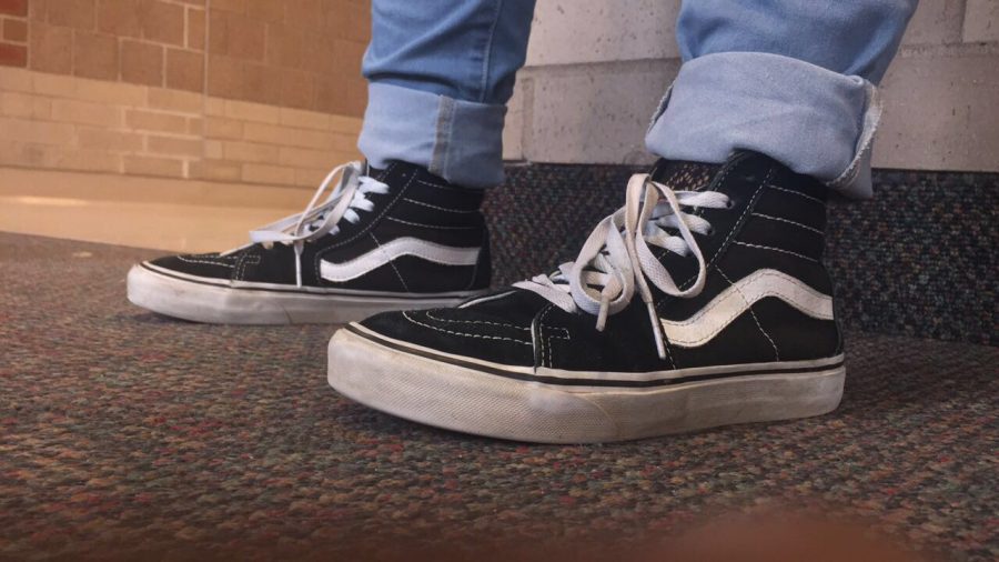 Darling Lee is wearing black Vans with a pair of jeans. Students like skateboarding shoes because they can be worn casual, or dressed up to look nicer.