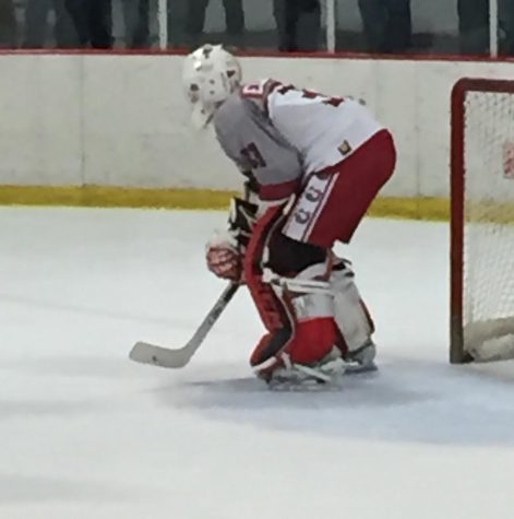 Seth on the ice, further from the goal and observing the game. Even in his experiences as a mite player, he would rush back to defend the goal despite being put at forward. “I would always volunteer to bring the equipment home,” Seth says.