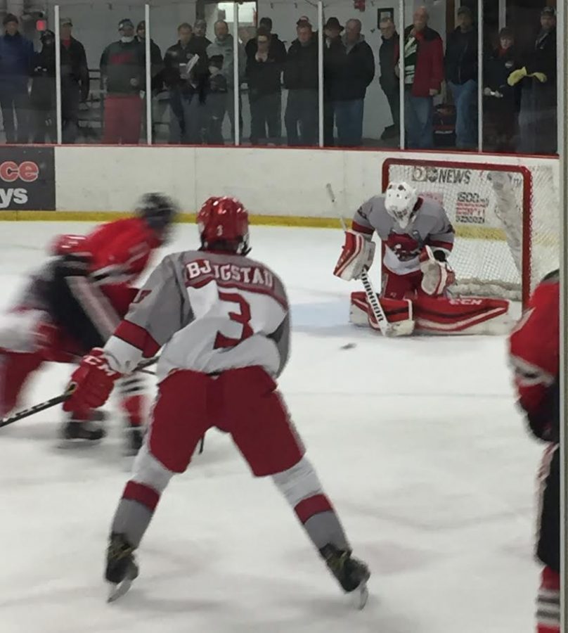 Seth blocking a shot by Lakeville North. “Being six foot five is a nice bonus because he covers so much of the net, but he is also great at being in the right position at the right time to make a save,” senior Michael Kaufman says.
