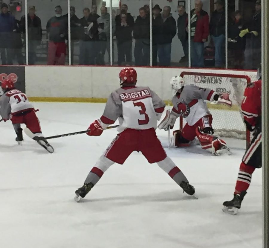 Seth preparing to defend the goal. “He is fast and big. He reacts well to the puck and it is so hard to beat him,” senior Mason Bartosh says.
