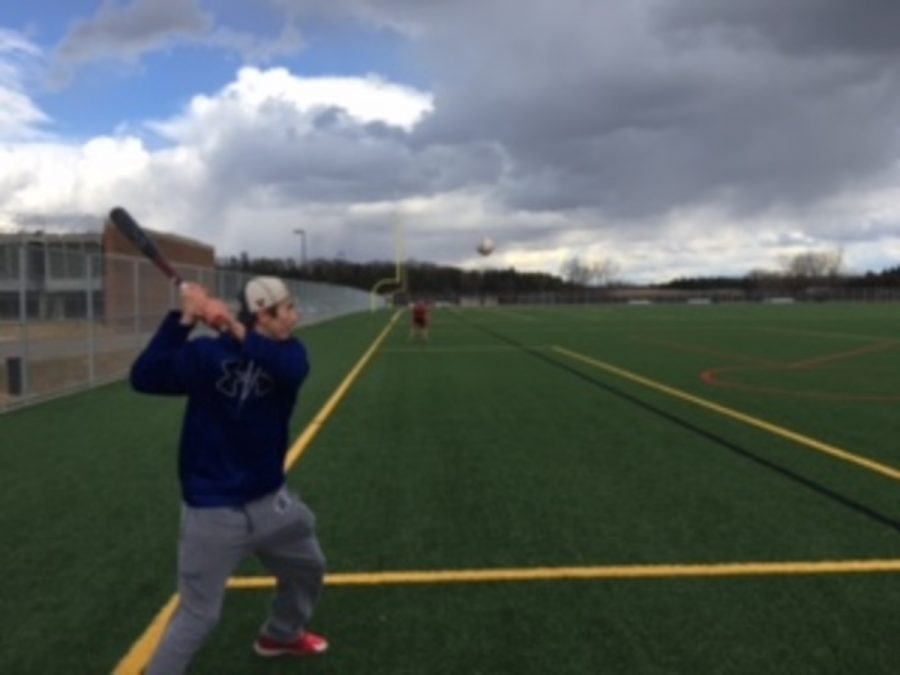 Senior Graham Laubscher hitting ground balls at captain practice, that take part on Tuesdays and Thursdays. Laubscher says, “Captain practices are a great way to shake off the rust for the season.”
