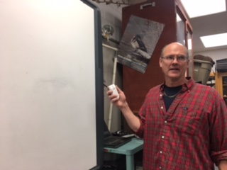 Weaver talks to students about science while doing stuff around the classroom while his class is at lunch. “Passing excitement and knowledge on about science and education to students is what it means to me to be a teacher,” Weaver says.