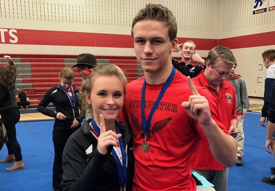 Lauren Thole (left) and Kevin Thole (right) both receive medals after performing extremely well on the same day as each other. Were in constant competition with each other, so that helps both Kevin and I motivate ourselves to perform better, Lauren said.