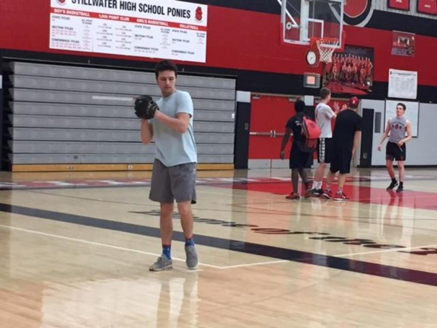 Senior Thomas Bruchu winding up for a pitch in the high school gymnasium.
“Obviously as you get older you have to narrow it down. I’ve narrowed it down to baseball, hockey and football,” Bruchu said.

