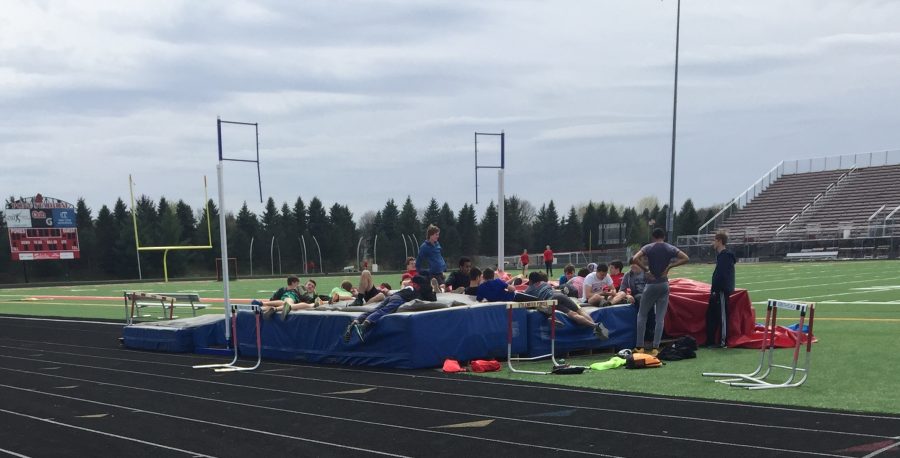 The boys track relaxing before practice. “I love running and spending time with my teammates and I’m very humbled that I get to continue my career next year,” senior Josh Phelps says.