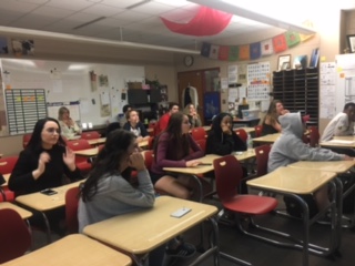  The yearbook club all sit and discuss a presentation made by one of its members. “As a group we change photos in yearbook all the time. Its Usually nothing too serious, but the photos need to be changed in order to benefit the finished product of the page, senior Sarah McCarthy says. 