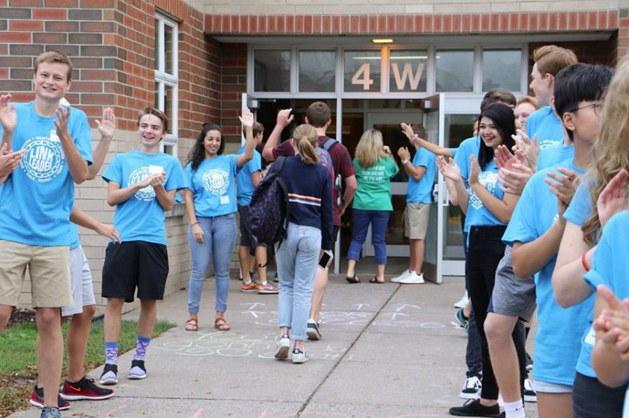 Senior and junior Link Crew leaders welcome freshmen students to the building on the first day of school. We tried to have the freshman in an open and safe environment where they wouldnt be worried about what we thought about them junior Peyton Classon, Link Crew leader, says.