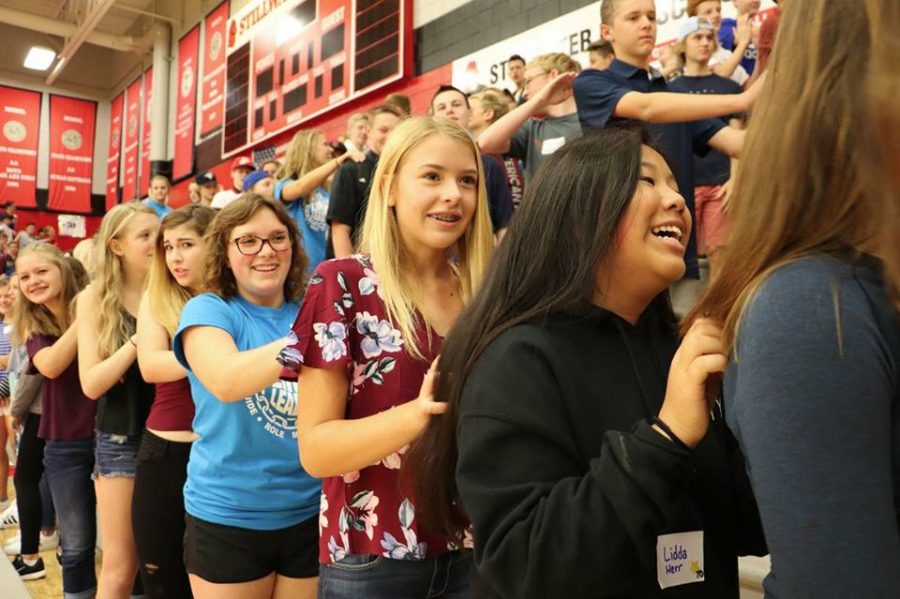 Senior Ava Dejonge helps lead a dance to welcome freshmen students. "Freshman were welcomed in and greeted by all of our Link Crew and friendly faces. We did lead up activities that allowed them to take safe risks and get to know new people" Erin Nickleby, health teacher and Link Leader says.