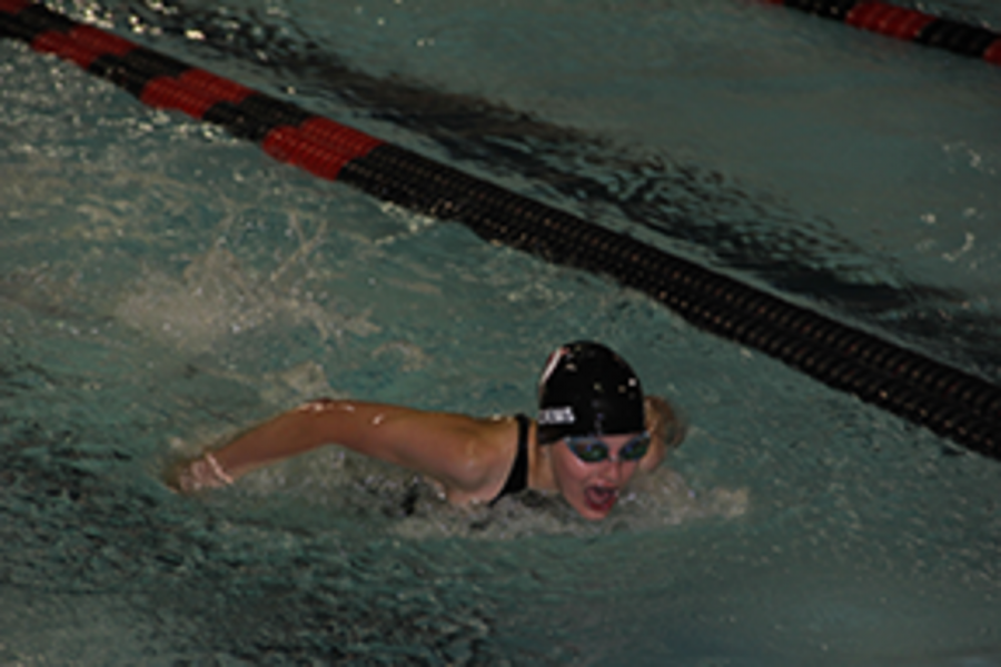 Eighth grader Estelle Auleciems  swimming the butterfly during Thursday’s meet against East Ridge.