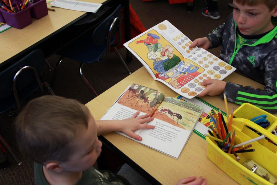 Kindergarteners in their spanish immersion class during reading time. Children have lots of energy so their teachers try to keep them as occupied as possible with different games and activities. “[teaching is] a lot of work but it is so fun,” Jennifer Nelson explains.
