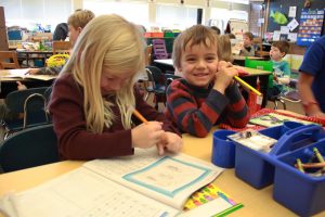 Kindergartners Ella Coles and Teddy Hanawalt work on their math problems in their spanish immersion class. “I love spanish immersion school; I don’t speak spanish but kind of,” explains Coles.
