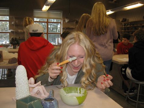 Sophomore Ashlynn O’Connor glazes her project final in clay and sculpture.
