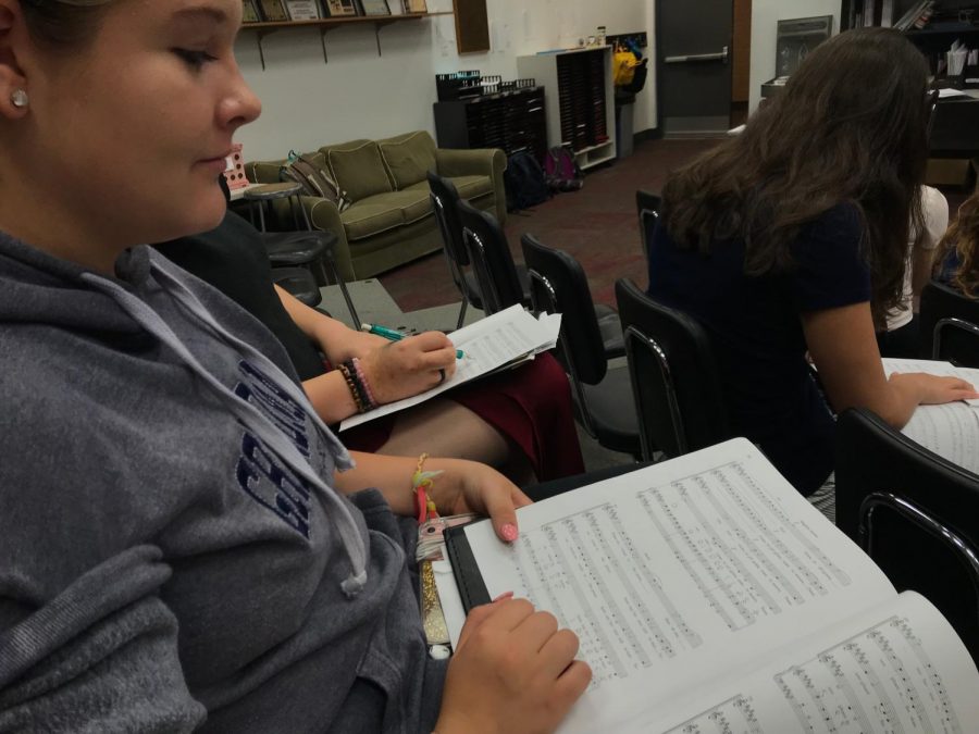 Sophomore Josie Haugen reading her music during choir in preparation for the retreat.