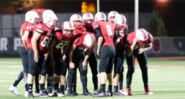 Last years sophomore team huddles before a play in their win against Mounds View. This year the Ponies take on Mounds View for Homecoming.