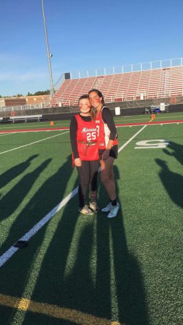 Madison Horn and Haley Nelson need to take a quick photo before getting ready for warm-ups for the Powder Puff game