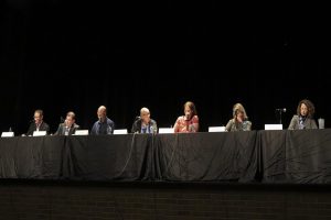 Running school board candidates Mark Burns, Matthew Cooper, Jon Fila, Don Hovland, Shelley Pearson, Tina Riehle, and Liz Weisberg speak at a panel. They are campaigning for the four school board seats opening on December 31st, 2018. 