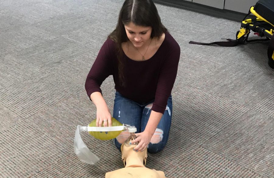 Malaina Fragnito practices using a bag valve mask to provide breaths during CPR. Fragnito is part of a 916 schools program that provides her with the opportunity to get her EMT certification during high school.