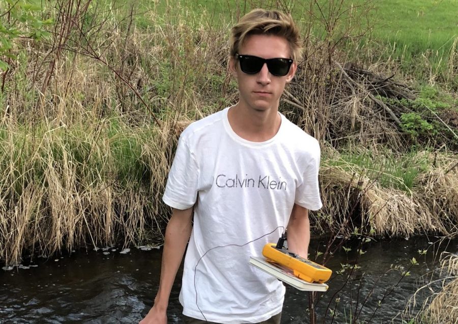 Junior Max Vogel after testing water from Browns Creek for the amount of various chemicals in the water. This natural stream is a prime example of where animals could be harmed if the water were to become dense in pollutants.