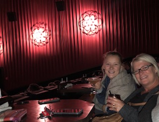 Delaney Farrell and Heather Farrell enjoying their drinks before seeing A Star is Born at the Alamo Drafthouse Cinema. Drinks courtesy of the wait staff, and mood setting lighting before the start of the movie provide for a calming experience at the theater.  