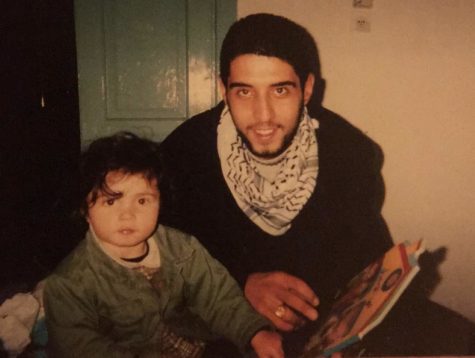 Tessa Johansenss father, Tarek Abu Bassam Abu Sbeih, reads to her from a childrens book. Johansen is back to visit him after moving to the United States with her mother, Gina Johansen.