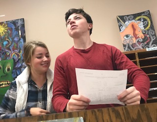 After school on Oct. 22, team members practice for their upcoming tournament at Minnehaha Academy. In the flex room, juniors Henry Still and Madi Kulzer rehearse their opinions on the new topic. Debaters will argue if Amazon is positively or negatively affecting America. 