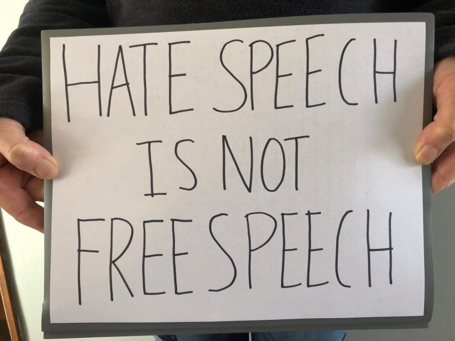 A popular saying seen at protests against the use of hate speech in America. Whenever someone says something negative about anyone, I think that its your job as a human to stand up for people,  junior Khuluc Yang said.