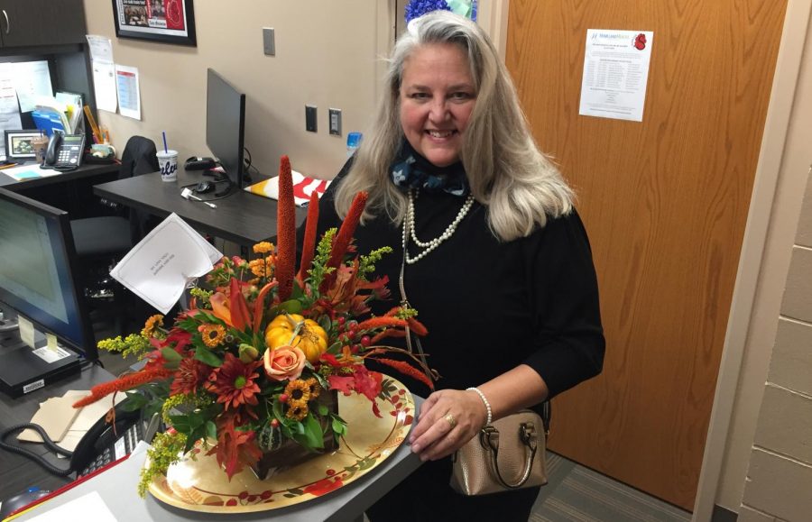 Mary Leadem Ticiu the Assistant Principal of the ALC gets flowers congratulating her for receiving the 50 over 50 award, recognizing her hard work and dedication to the ALC and its students. Ticiu has been at the ALC for three and a half years.