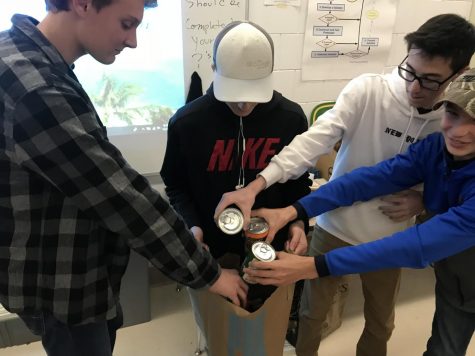 Junior and sophomore boys bring in food to help support the food drive hosted by NHS. Alex Wiegel, Ethan Hall, Andy Constant and Caleb Catt-Hall brought five items each so their first hour class could win the bagel party. 