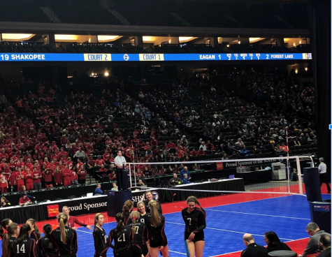 Junior Maddie Whittington and her team, celebrates win against Shakopee on Nov. 8 at the state tournament. 