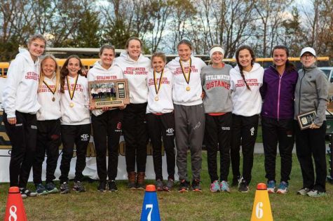 Members of the Ponies girls cross country team celebrated their conference championship with Coach Podolske. The Ponies would go to capture fifth place at the State meet.