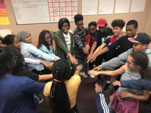 Members of the Black Student Union make a huddle to celebrate a successful meeting. These students form long-lasting bonds through a common ground. 