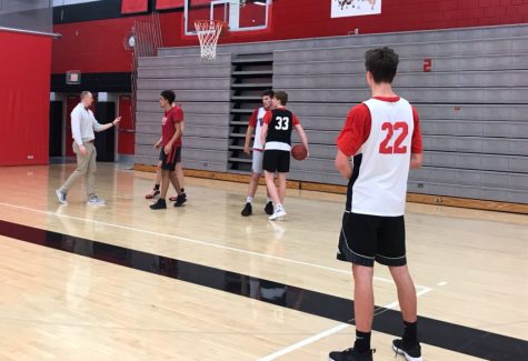 Boys basketball practices as coach Hannigan and coach Jordan give constructed feedback.