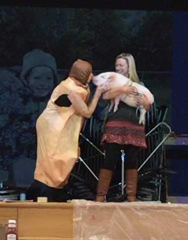 Andersen Principal Anna Wilcek porkers up to pig