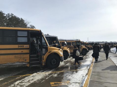 Children frequently have to get on and off the school buses. The school buses are all lined up and ready to begin their journey to drive children home safely. A new bill in congress is being debated on currently to put cameras on the school buses.