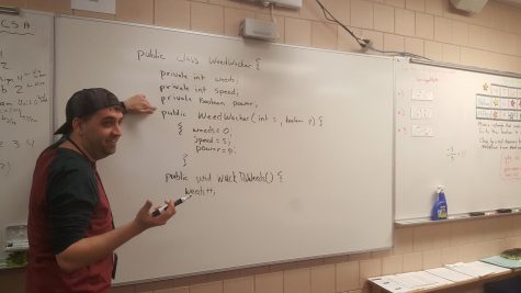 AP Computer Science teacher Nicholas Springer teaches his class how to code a weed wacker. Springer enjoys teaching his students that they can code anything they can imagine.