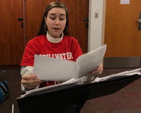 Senior Mya Lynse looks over a piece she has been working on. In her free time, Lynse works on new music that has not been created before. 