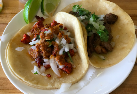 The two tacos pictured above are served at La Carreta Authentic Mexican Restaurant.  The taco on the left is Pastor (marinated pork) and the taco on the right is Asada (beef).  La carreta also serves Lengua (tongue) and Carnita (pork) tacos among other authentic flavors.