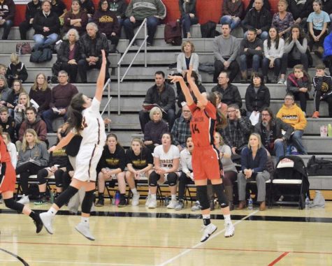 Senior Sara Scalia shoots a basket Dec. 7 during their game against Forest Lake. The girls won with a score of 59-52. 