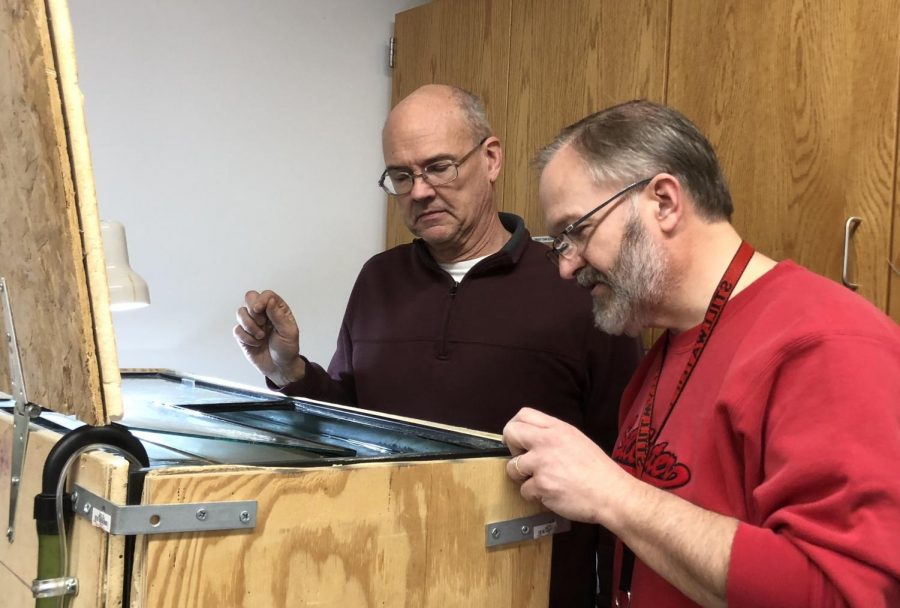 Weaver and Boettcher check on the tank. The tanks water levels are carefully kept. 