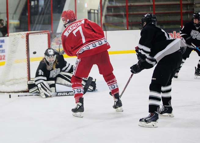junior Noah Tussey buries the puck against Rosville. Stillwater ended up winning 8-2.