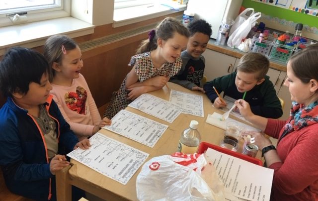 Lake Elmo elementary kindergarten students enrolled in the Amigos Unidos program work on a project. Students spend the majority of the school day learning in Spanish rather than English.