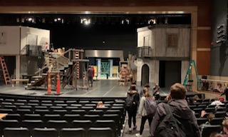 Senior John Caskey and other theatre members get ready to rehearse for their next musical Les Misérables. The musical is set to be performed during April 5-13. 