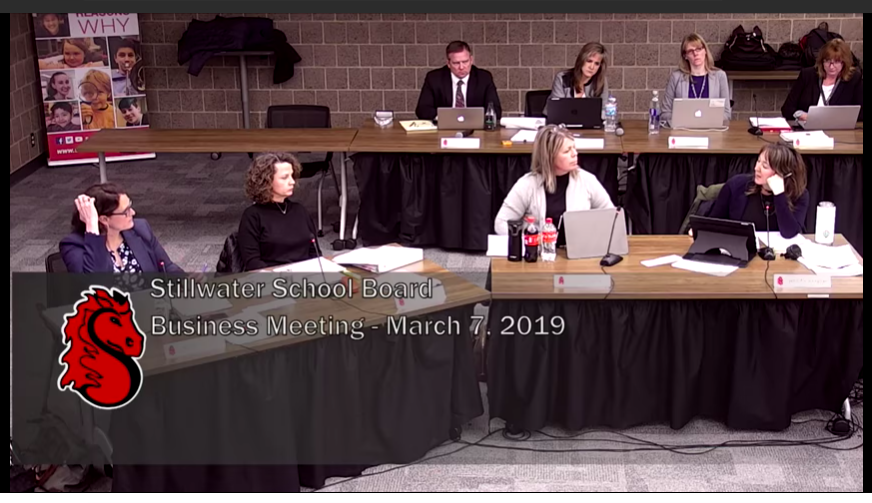 The School Board discusses their action items at the school board meeting. Staff development cuts passed 5-1, with Board Member Jennifer Pelletier (right) the only nay.