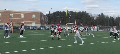 Boys lacrosse team practices for their upcoming season on the school's turf fields for captain's practice. They consistently work on their passing and catching.