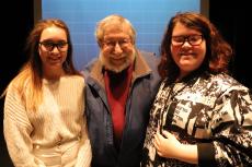 Eighth graders Berit Serle (left)  and Kennedy Tope (right)  had the exciting opportunity to have Fred Amram (middle) talk to their class about his experiences in the Holocaust.