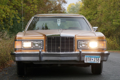 Senior Jack Norton shows off his 1978 Mercury Cougar. Nortons classic car is something he never thought he would buy. He loves his car because it is not anything most people see anyone else driving. 