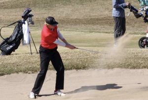 Senior captain Wyatt Wasko hits a sand shot during a conference match. The Ponies are a part of the Suburban East Conference and are joined by eight other teams from around the area. 