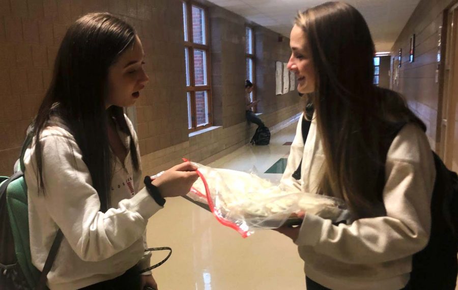 Marquez sells a cinnamon roll to junior Olivia Velte. Her cinnamon rolls are priced at $3 a piece. 
